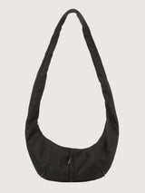 Black shoulder bag on a light gray background