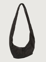 Black shoulder bag on a light gray background