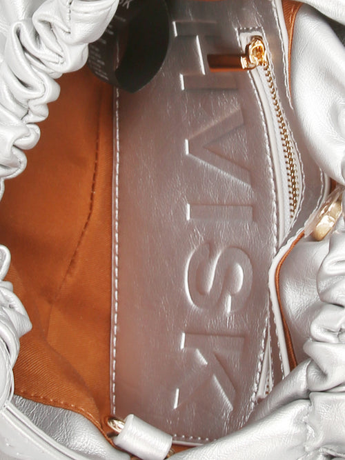 Silver mini handle bag with magnetic closure and knotted detailing on the handles.