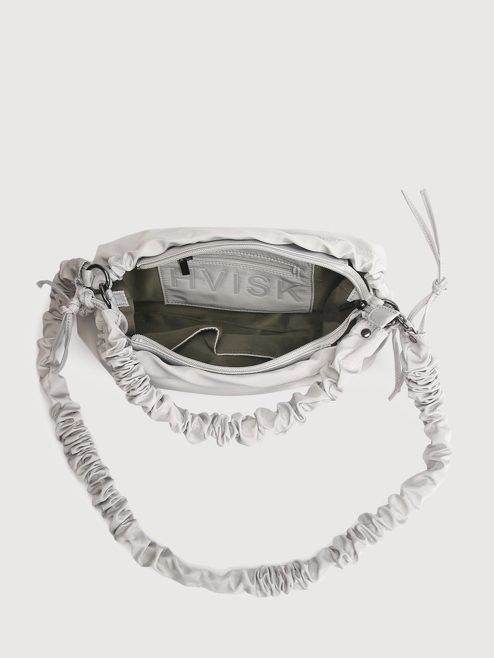 Grey handbag with ruched strap on a white background