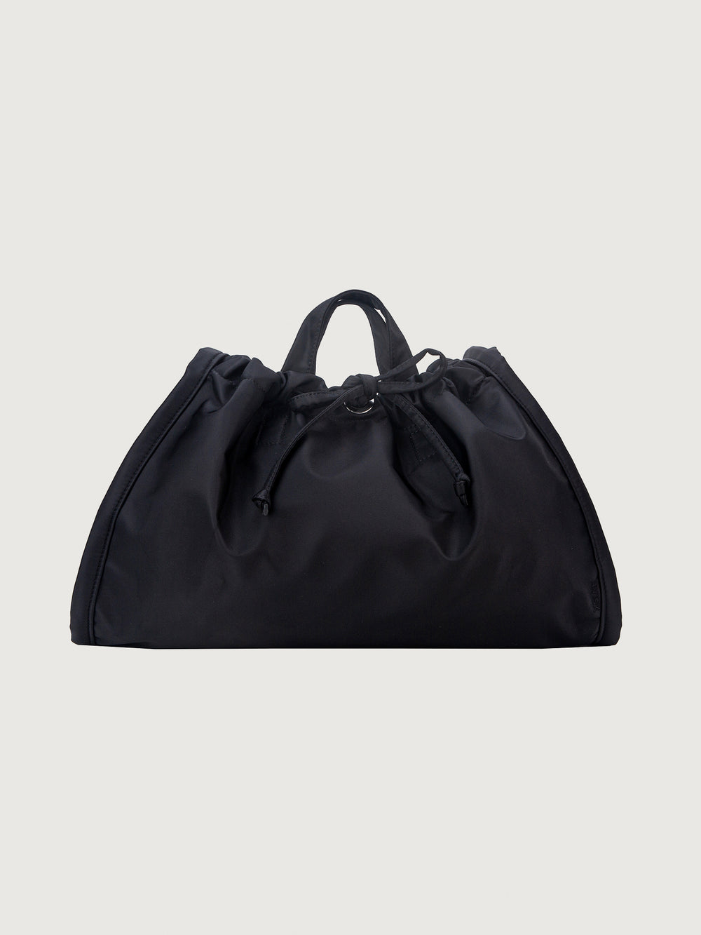 Black drawstring bag on a light gray background