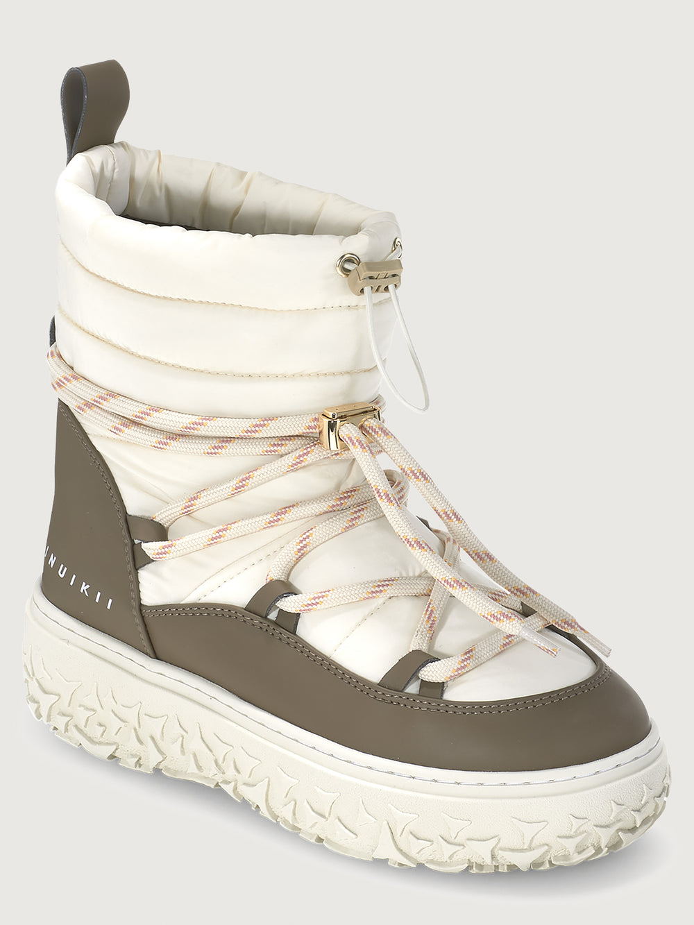 White and brown winter boot with visible brand logo on a light gray background