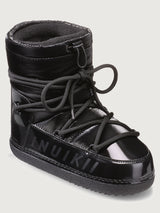 Black winter boot with brand logo on a light gray background