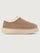 Brown slip-on shoe with white fur lining on a beige background