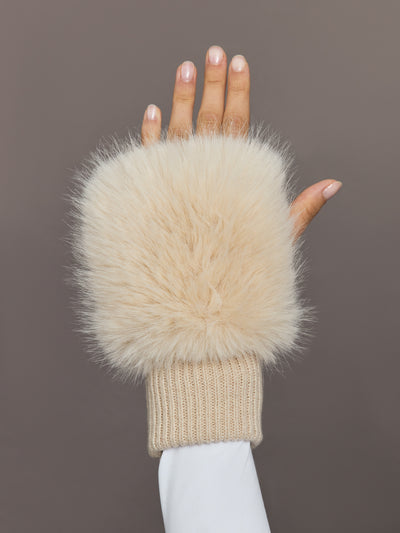Close-up of beige faux fox knit mitten with ribbed cuff, front view.