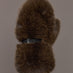 Model is holding the Faux Fur Fox Mitten Chocolate, front view of the faux fur exterior.