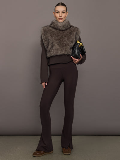 Model is wearing the Faux Fur Pullover Vest with Side Ties Mocha, full body view.