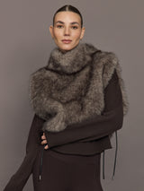 Model is wearing the Faux Fur Pullover Vest with Side Ties Mocha, front view.
