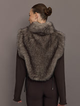 Model is wearing the Faux Fur Pullover Vest with Side Ties Mocha, back view.