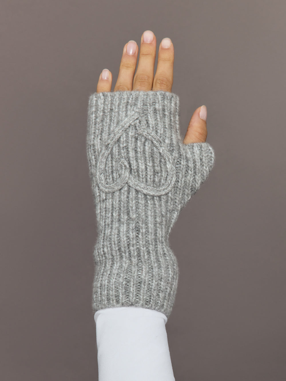Front view of light grey fingerless knit glove with embroidered heart detail.