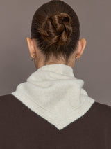 Back view of Knit Triangle Pull Thru Scarf with Hand Sewn Beads in ivory showing shape and fit.