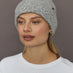 Model wearing Love embroidered knit hat in light grey, front view.