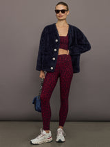 Melt red leopard square neck sports bra styled with matching leggings and navy cardigan, full outfit view.