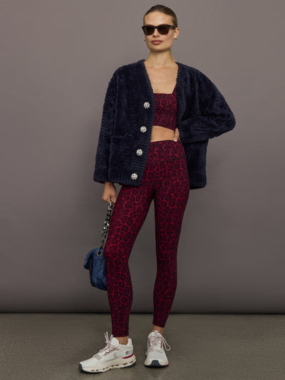 Melt red leopard square neck sports bra styled with matching leggings and navy cardigan, full outfit view.