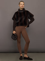 Full outfit view of dark brown faux fur pullover sweatshirt styled with brown ribbed leggings and loafers.