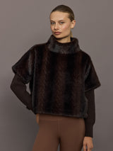 Model wearing dark brown faux fur pullover sweatshirt, front view close-up.