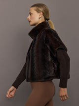 Side view of dark brown faux fur pullover sweatshirt showing high collar and relaxed fit.
