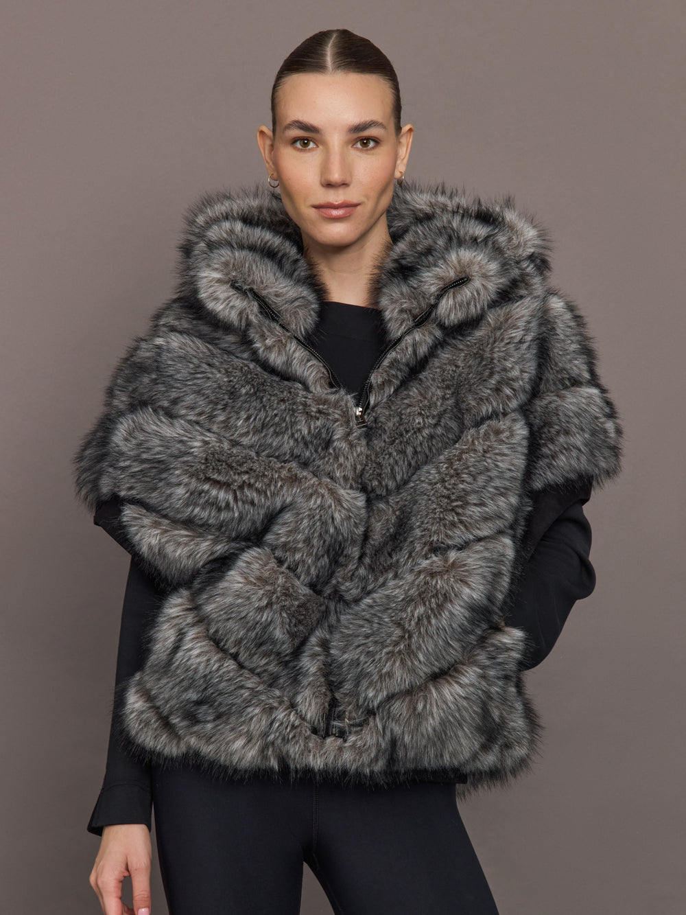 Model is wearing Faux Fox Hooded Chevron Short Sleeve Jacket in grey, front view.