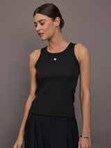 Model is wearing KR Ribbed Performance Tank in black, front view.