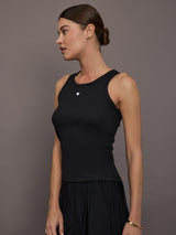 Model is wearing KR Ribbed Performance Tank in black, side view.