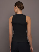 Model is wearing KR Ribbed Performance Tank in black, back view.