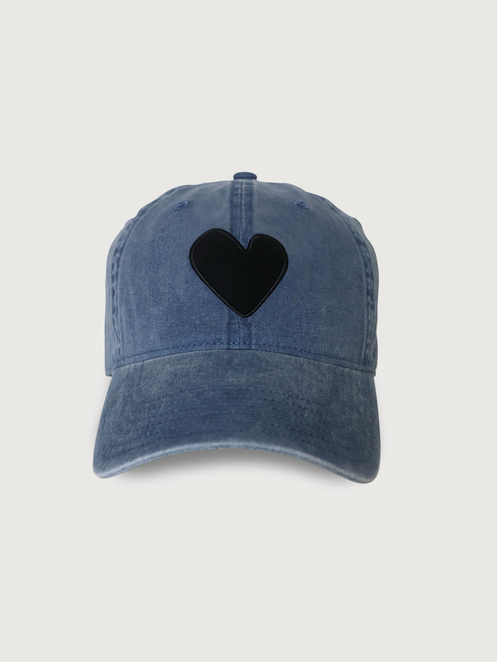 Blue denim cap with a black heart.