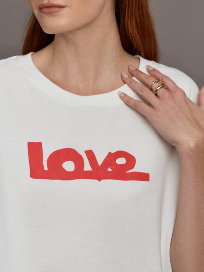 Model wears white short-sleeve t-shirt with a red 'Love' design on the front.