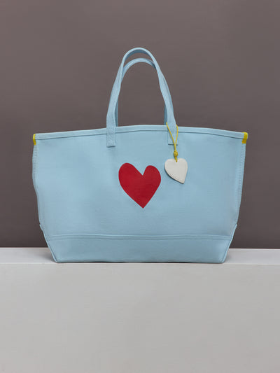 Baby blue tote with a big red heart. 