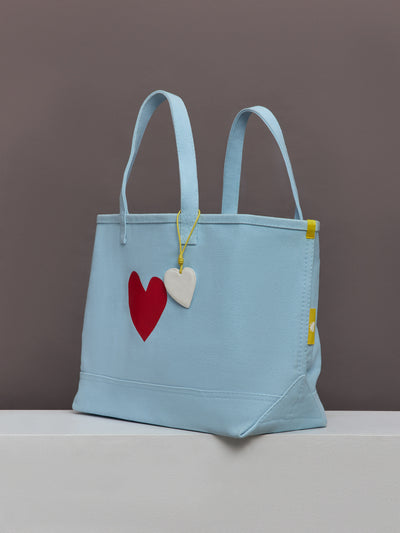 Baby blue tote with a big red heart. 