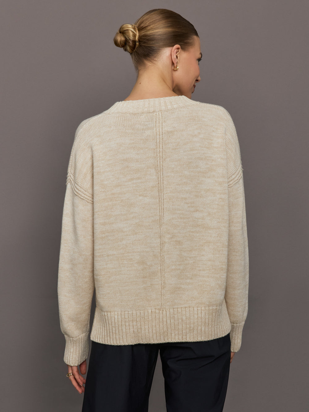 Beige sweater with 'LOVE' text and red heart design.