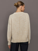 Beige sweater with 'LOVE' text and red heart design.