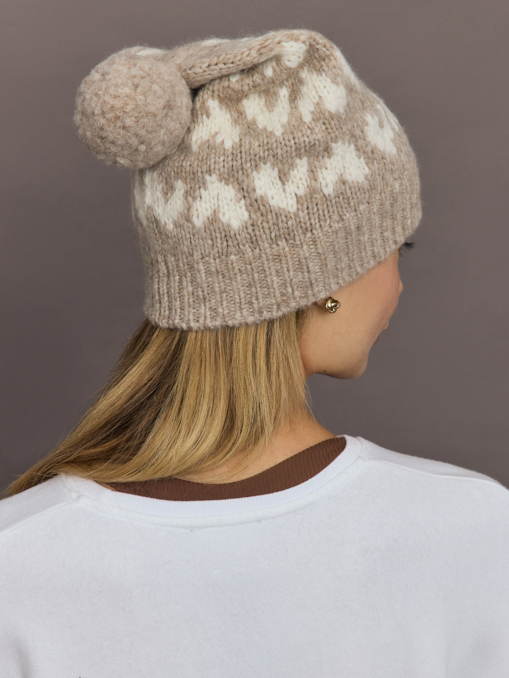 Back view showing full heart pattern and pom pom detail.