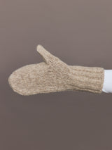 Side view of camel knit mitten showing ribbed cuff detail.