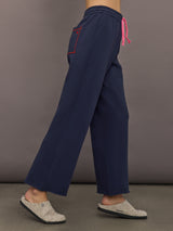 Side view of indigo blue sweatpants showing relaxed leg fit.