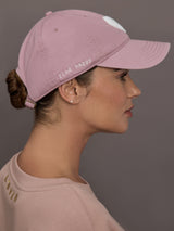 Model is wearing KR Imperfect Chenille Heart Hat in mauve, side view with find happy embroidery.