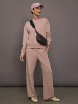 Model is wearing Weekend Barb fleece sweatpant in Mauve, full body front view.
