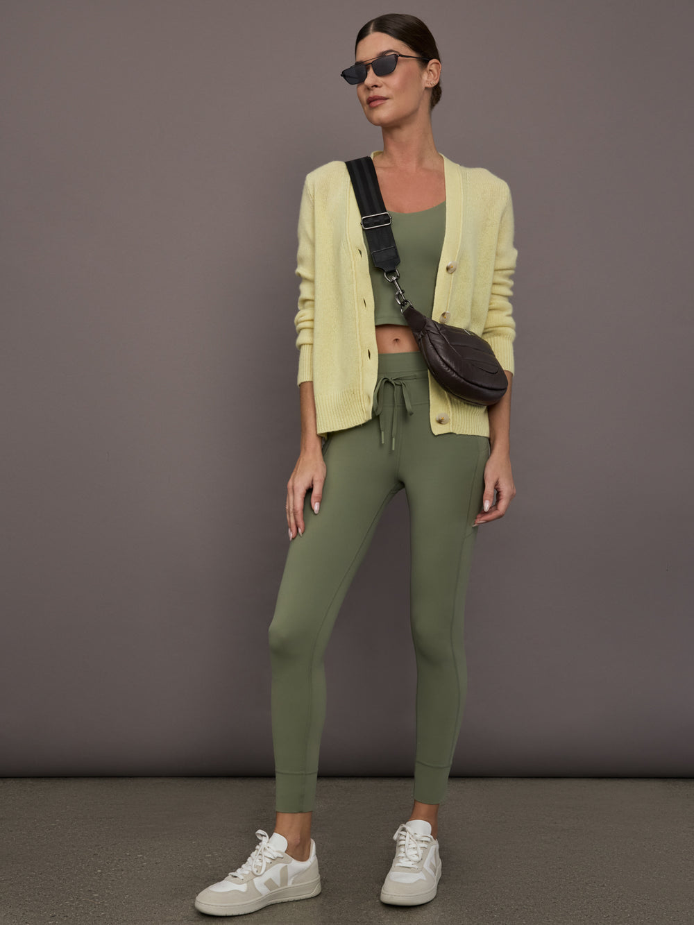 Model is wearing Featherweight Cashmere Button Cardigan in Lemon Tint, full body layered look.