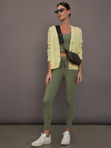 Model is wearing Featherweight Cashmere Button Cardigan in Lemon Tint, full body layered look.