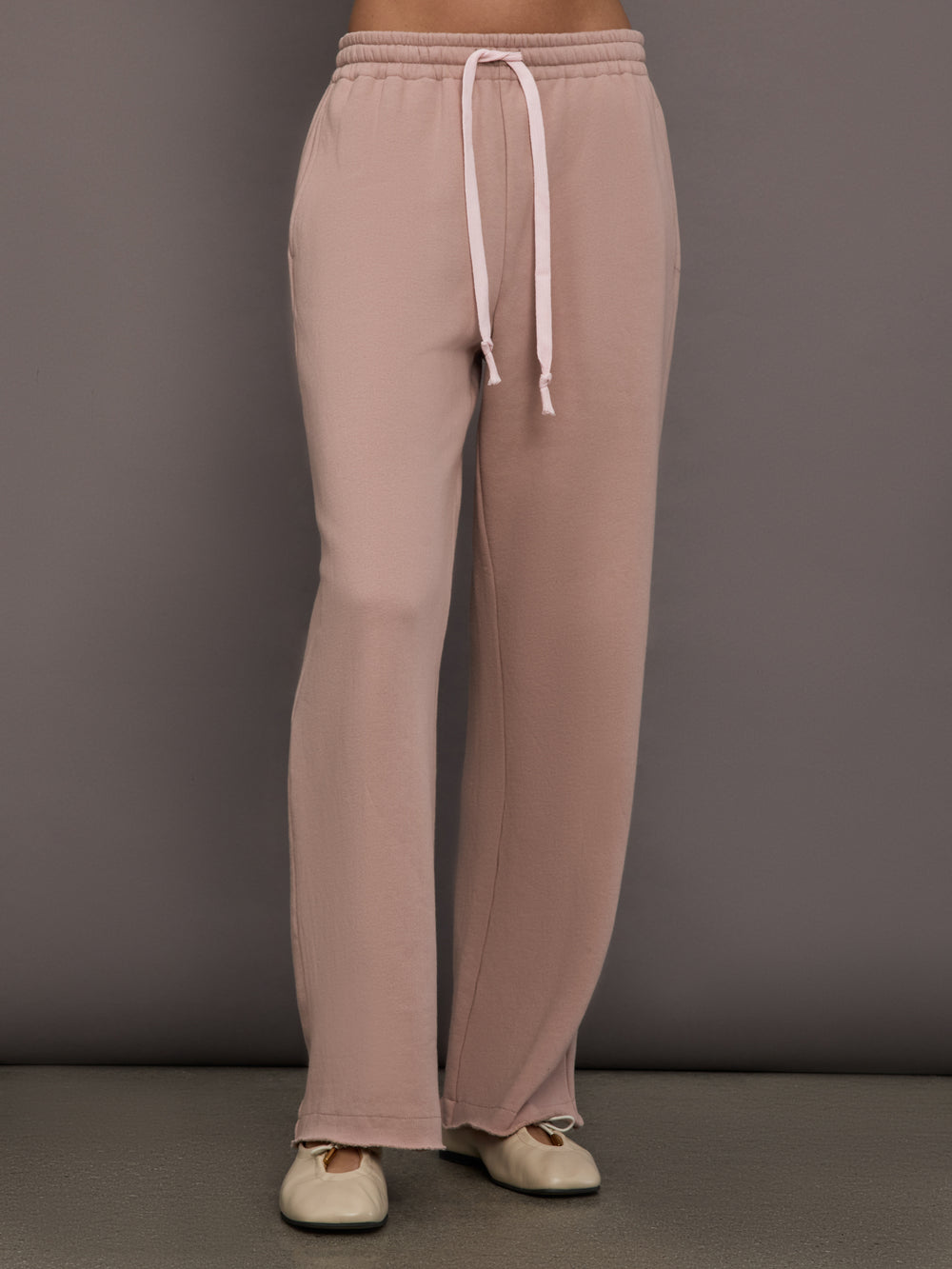 Model is wearing Weekend Barb fleece sweatpant in Mauve, front view.