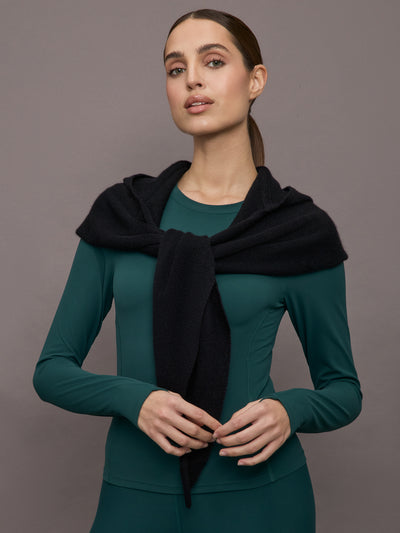 Model wears a black scarf over her shoulders. 