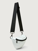 White patent leather bag with black hardware, featuring a half moon shape.