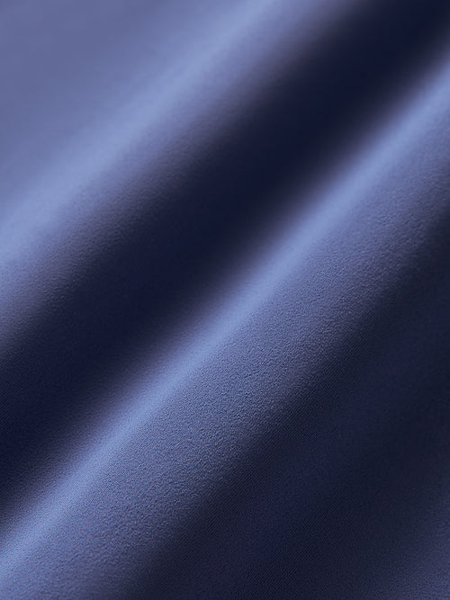 Close-up of dark blue fabric with a smooth texture