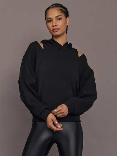 Model is wearing Scuba Fleece Cutout Hoodie Black, front view.