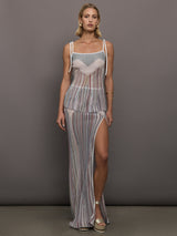 Model wearing a multicolor tank top with a loose fit and adjustable tie straps.