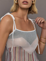 Model wearing a multicolor tank top with a loose fit and adjustable tie straps.