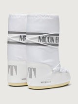 White moon boots with 'Moon Boot' branding on a light gray background