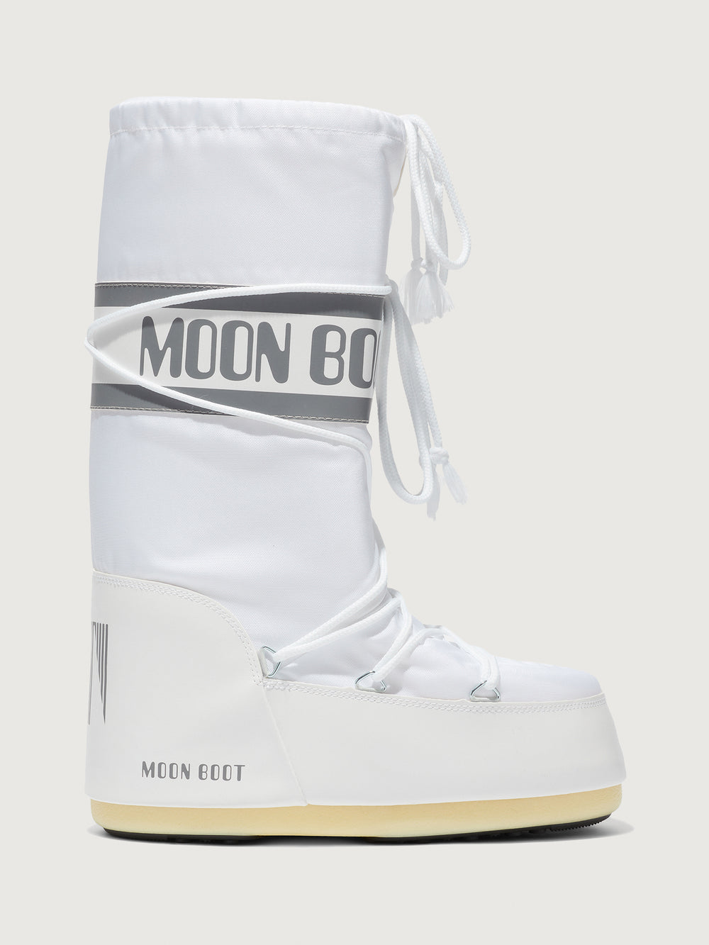 White moon boot with 'MOON BOOT' branding on a light gray background