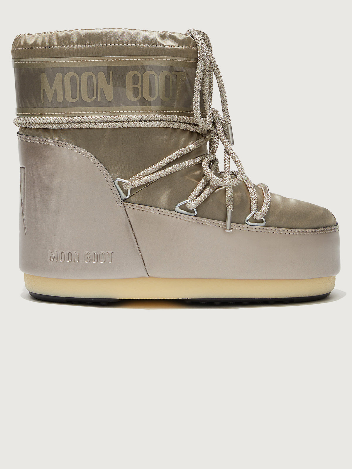 A pair of Moon Boots in gray with drawstrings.