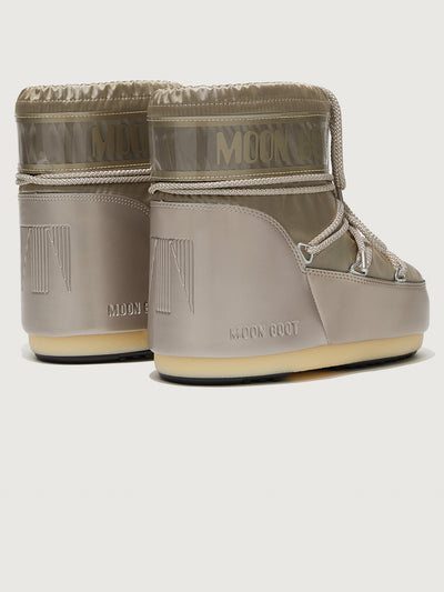 A pair of Moon Boots in gray with drawstrings.