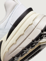 Gray and black sneaker with Nike logo on a white background